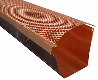 Copper gutter guard using stainless steel hinges clips to K style copper gutter.